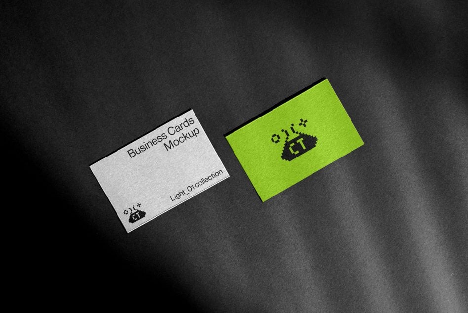 White business card beside neon green card with pixel logo on dark background
